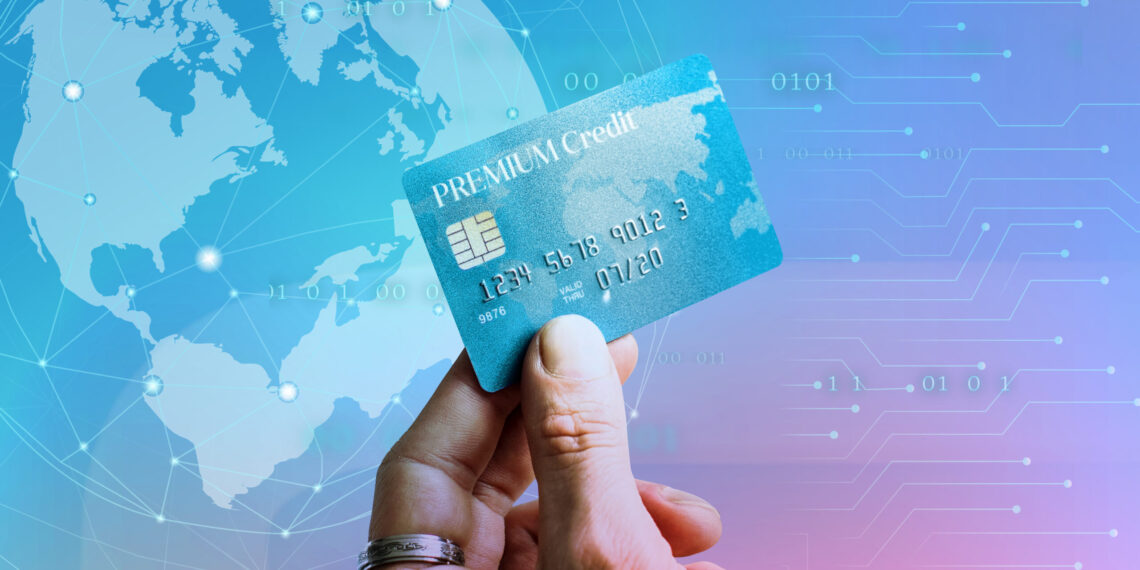Breaking update : overseas transactions to cost more;fees raised to 3. 14% 10 Woman holding a premium credit card